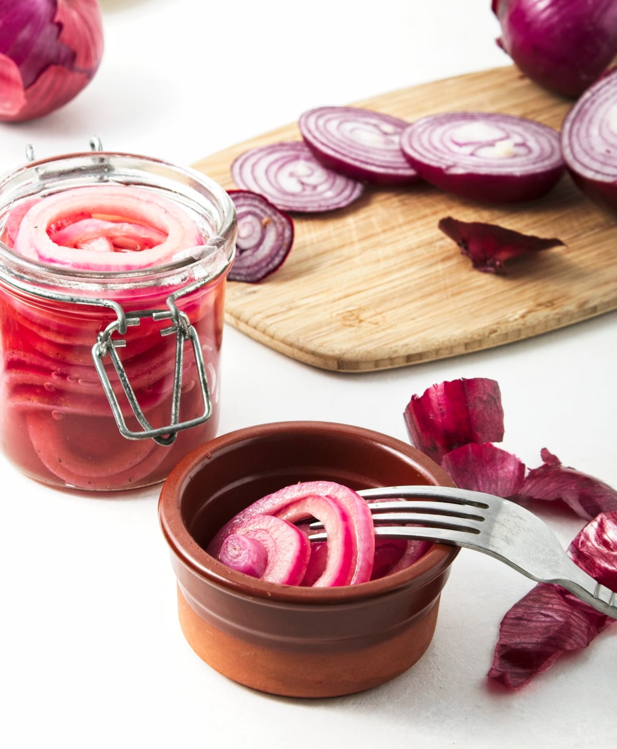 pickled onions on a fork