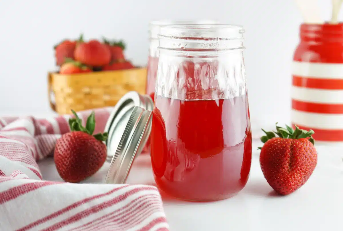strawberry simple syrup in a jar