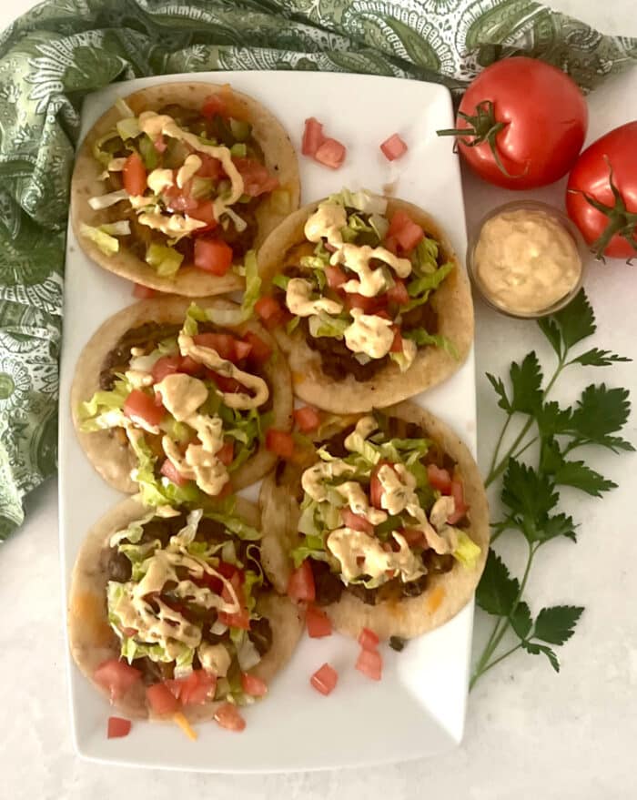taco burgers on an oblong platter