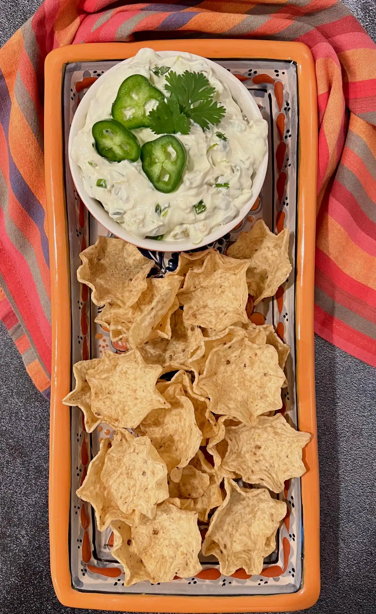 dip and tortilla scoops on serving platter