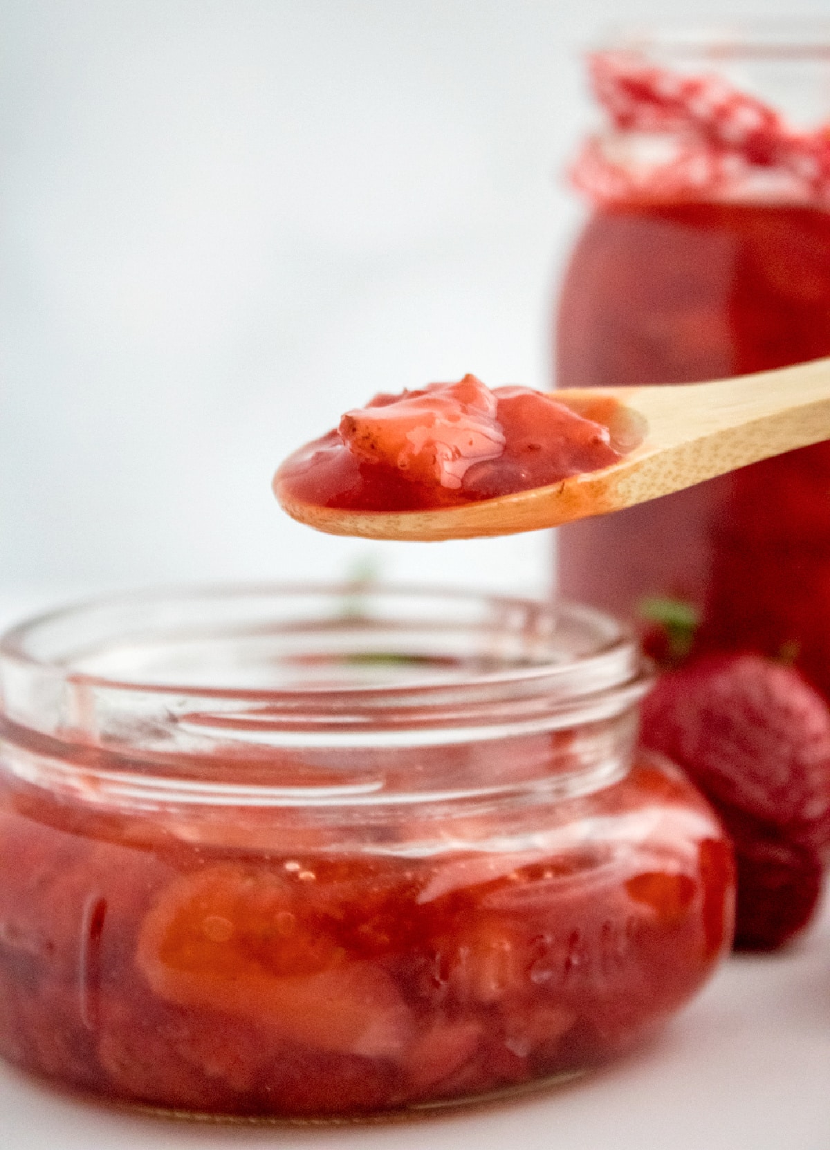 strawberry preserves on a wooden spoon