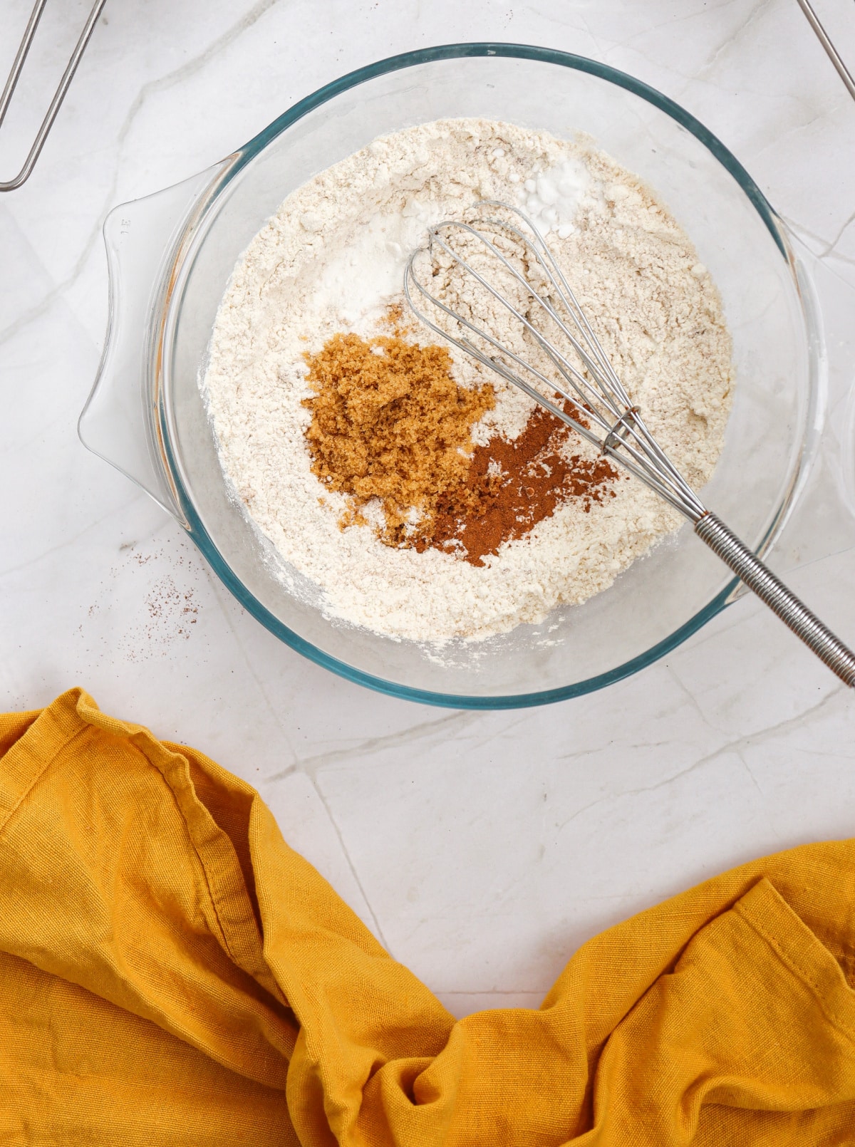 combining spices and flour for pumpkin pancakes