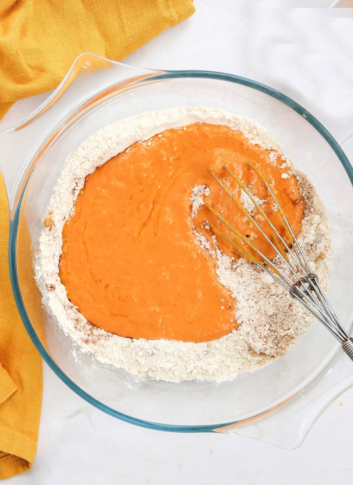 adding pumpkin mixture into dry ingredients