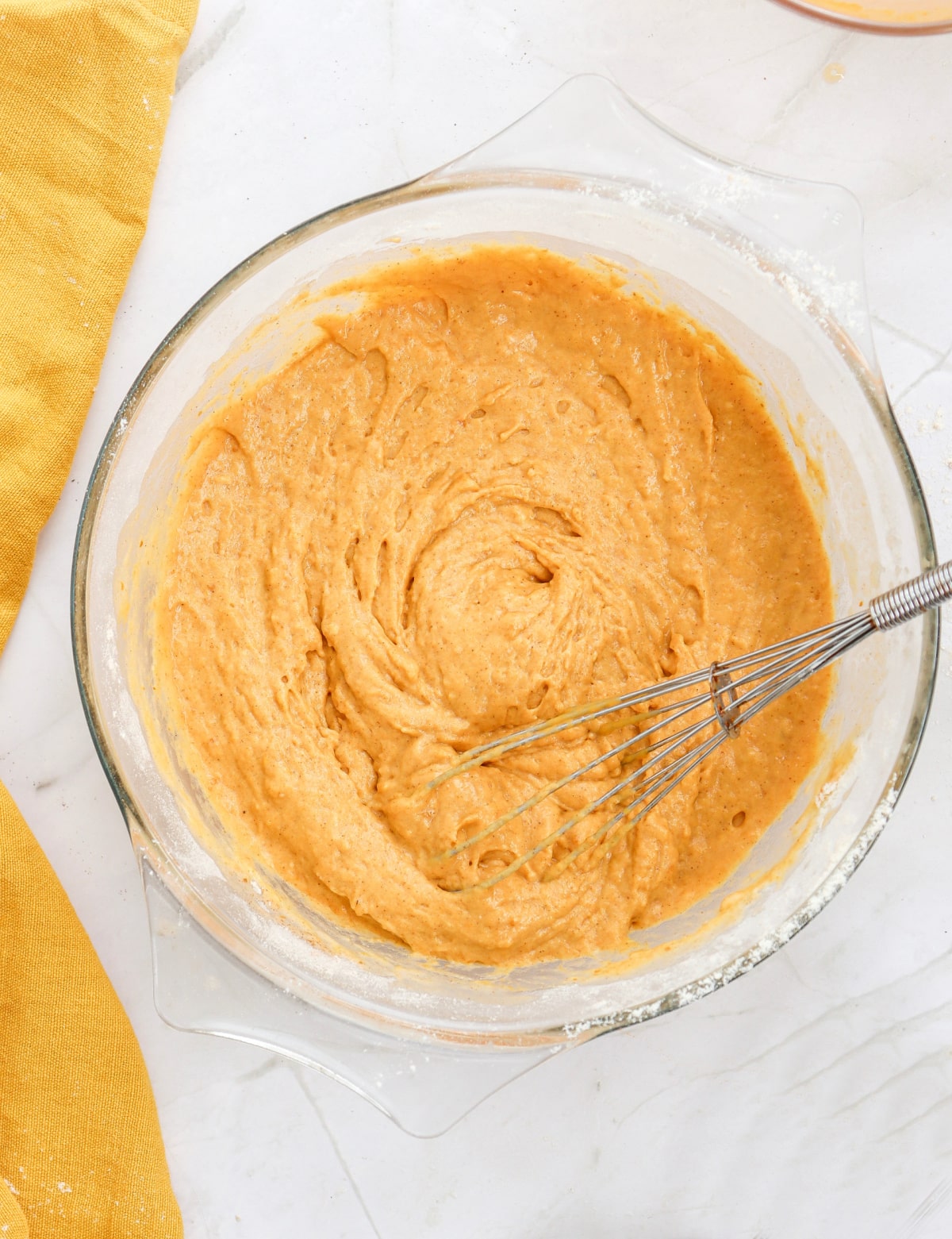 mixing pumpkin spice pancakes batter until blended