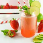 strawberry agua fresca in glasses with lime and mint