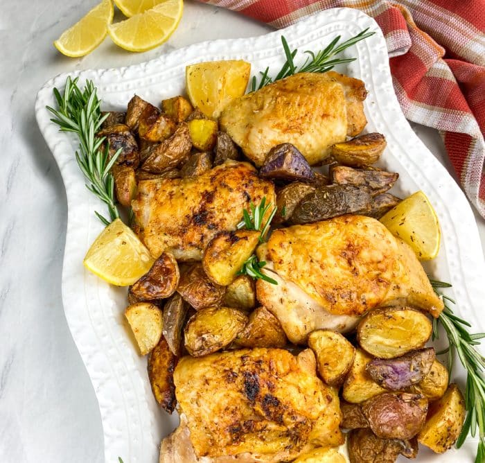 air fryer chicken and potatoes on a white platter