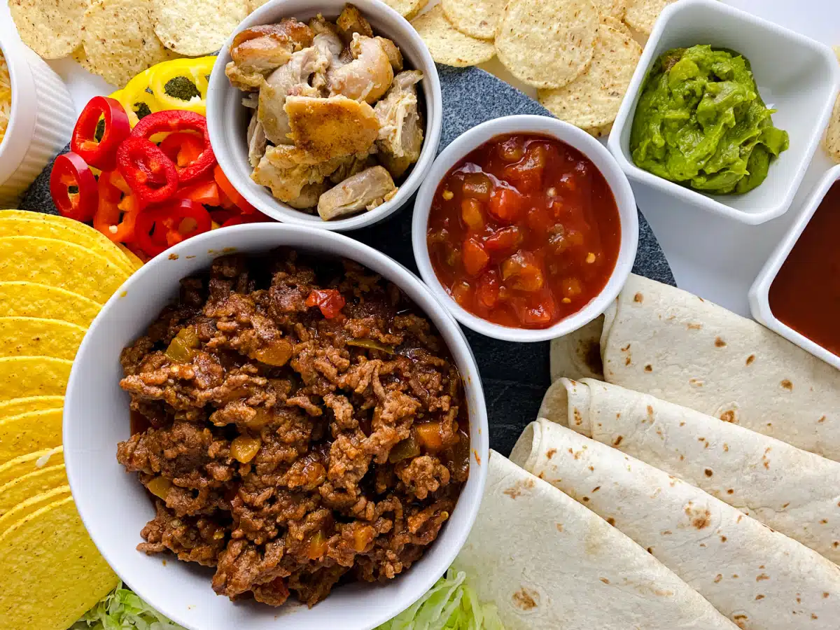 assorted taco fillings and toppings