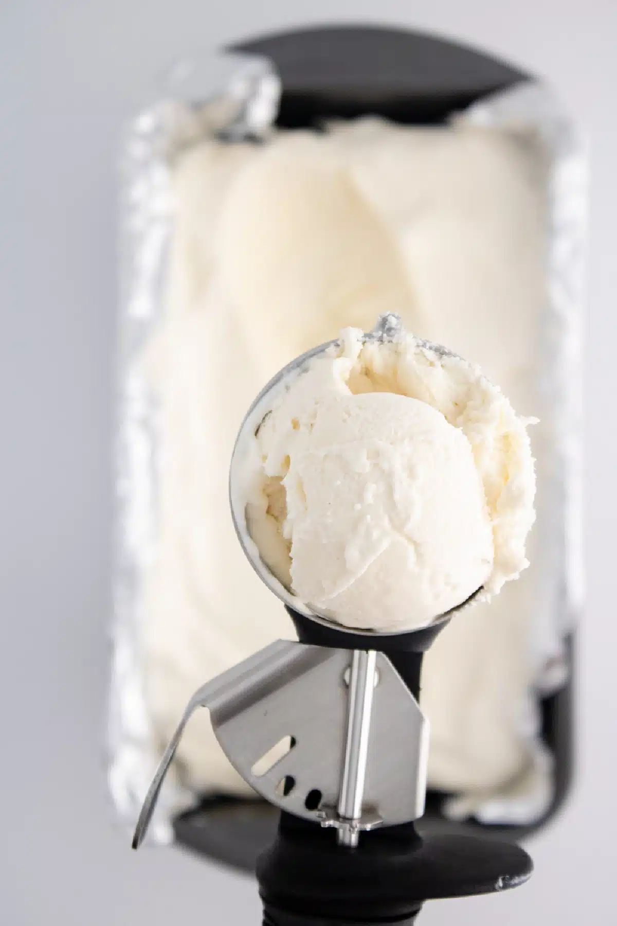 ice cream scooper of vanilla bean ice cream