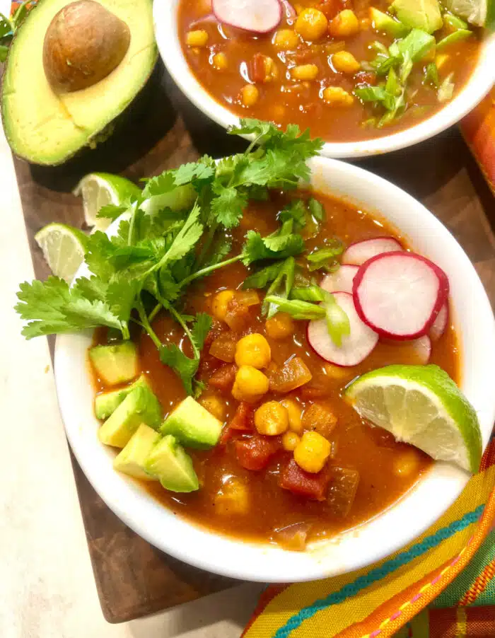 overhead photo of two bowls of pozole soup
