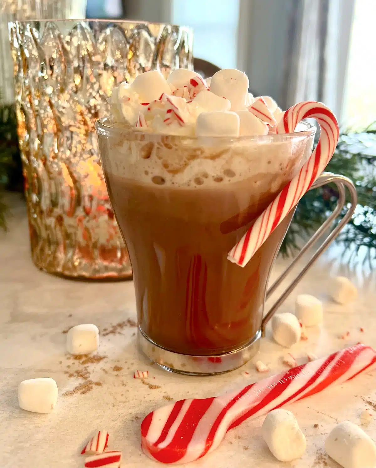 pappermint cocoa coffee in mug with candy cane