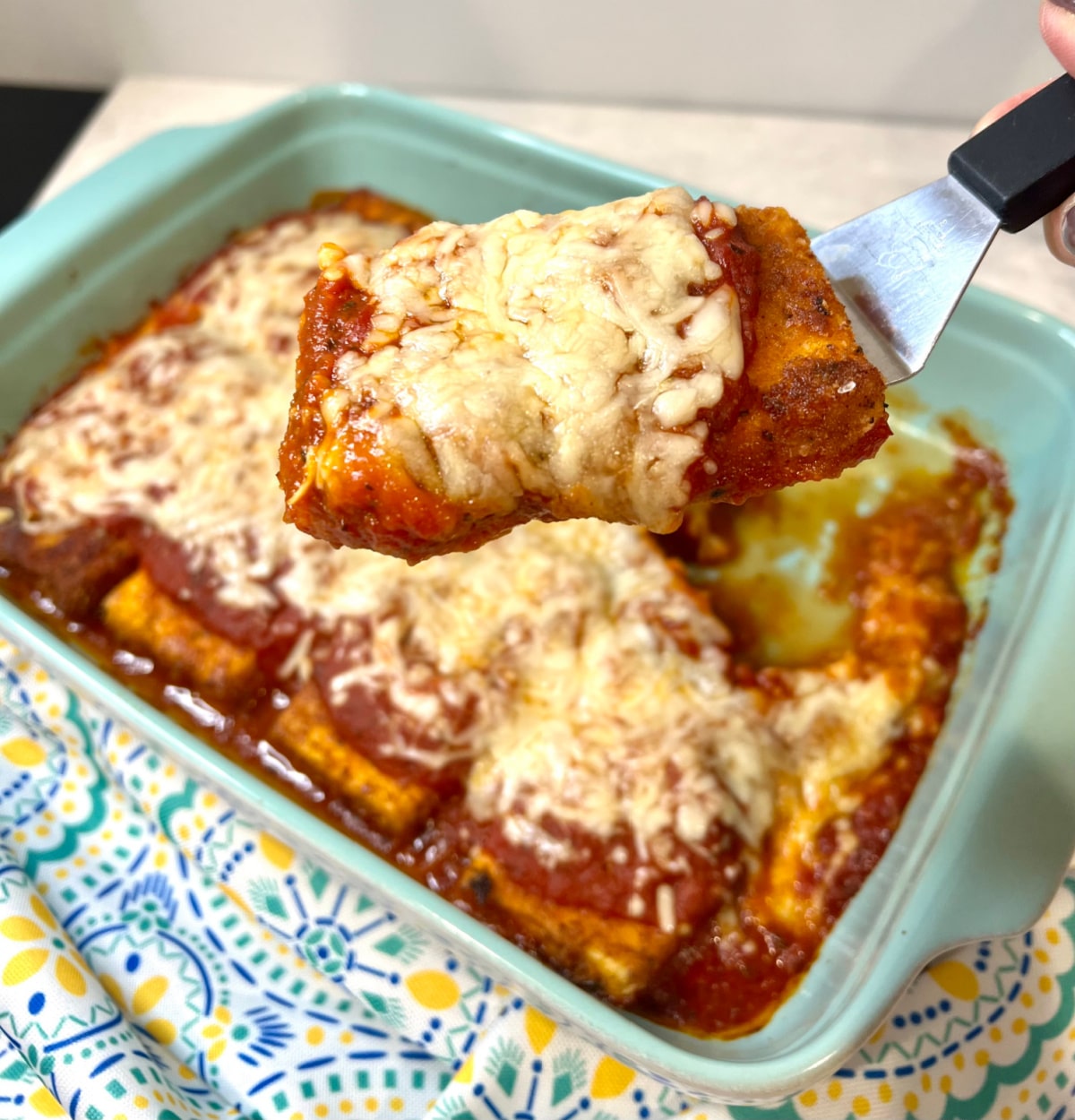 piece of tofu parmesan on spatula