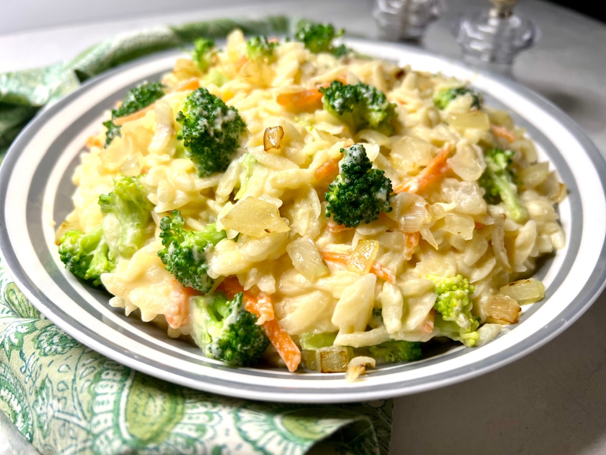 cheesy broccoli orzo in a serving dish