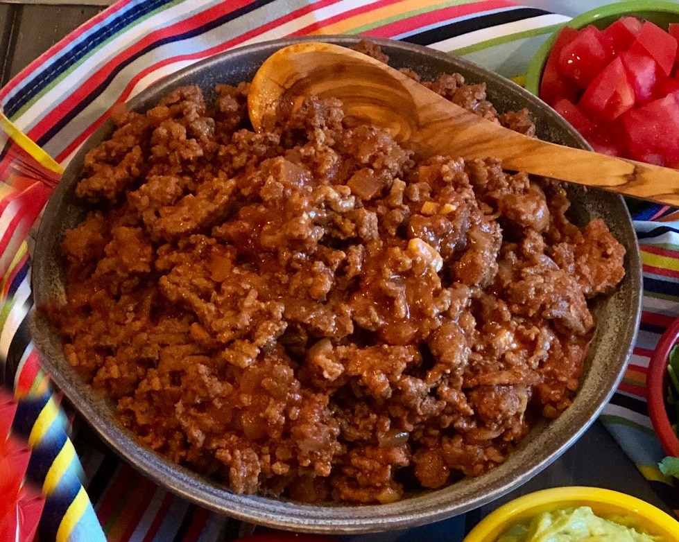 bowl of taco meat with wooden spoon