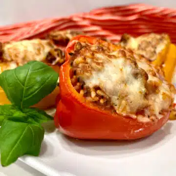 close up of a stuffed red bell pepper with cheese