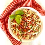 overhead photo of bruschetta pasta with fresh basil garnish
