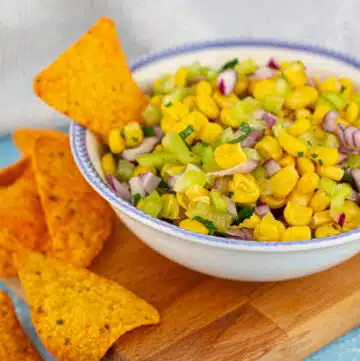 chipotle corn salsa in a white bowl with tortilla chips