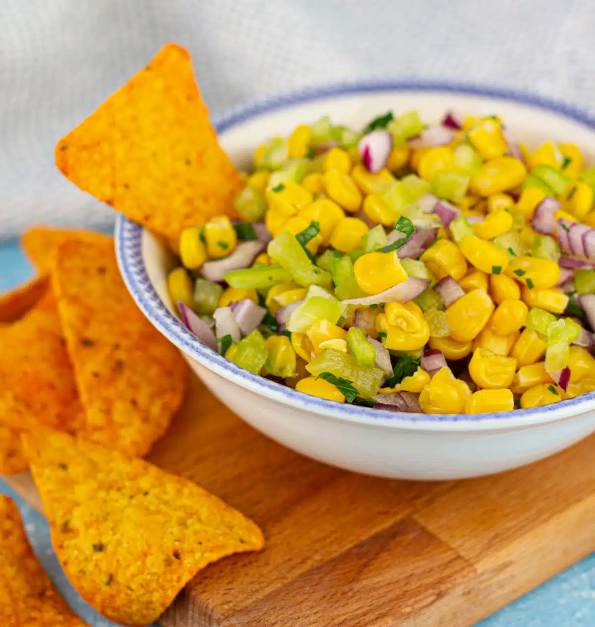 chipotle corn salsa in a white bowl with tortilla chips