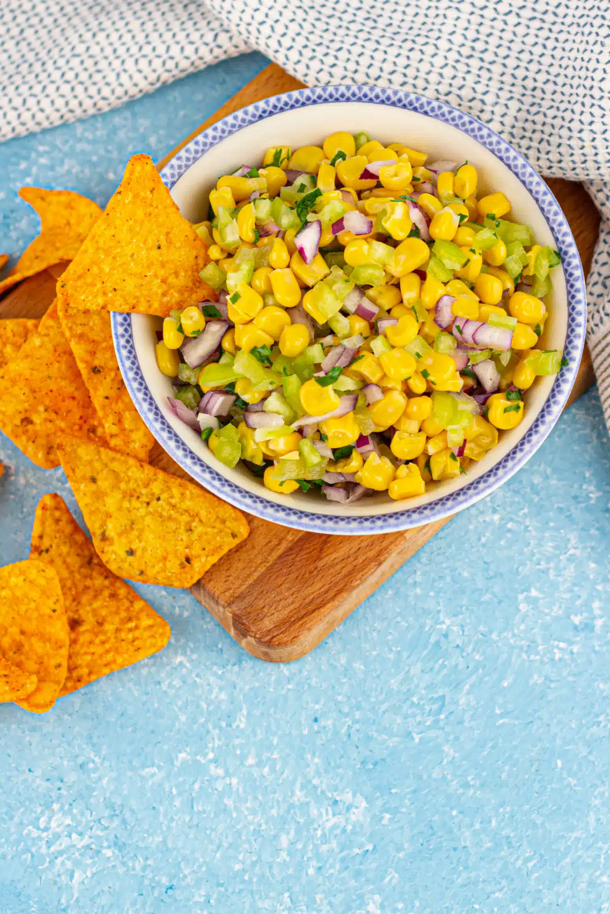 overhead of corn salsa in a bowl with tortilla chips