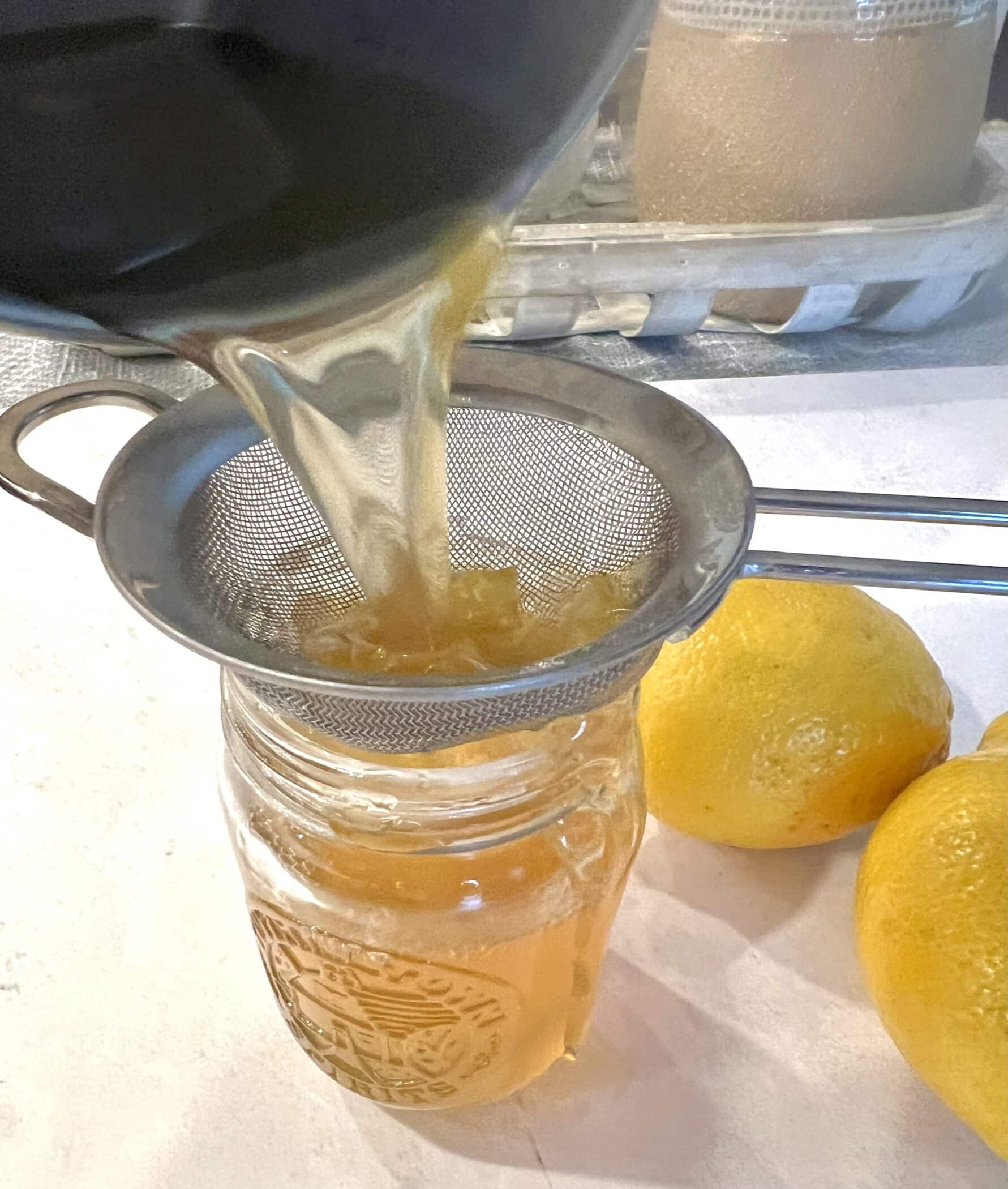 straining the lemon peels