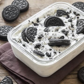 homemade oreo ice cream in a container with cookies