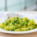 pasta with peas recipe in a white bowl