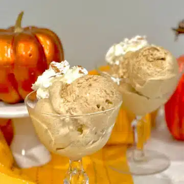 scoops of pumpkin spice ice cream with whipped cream topping