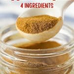 apple pie seasoning in a jar with a spoon and text overlay