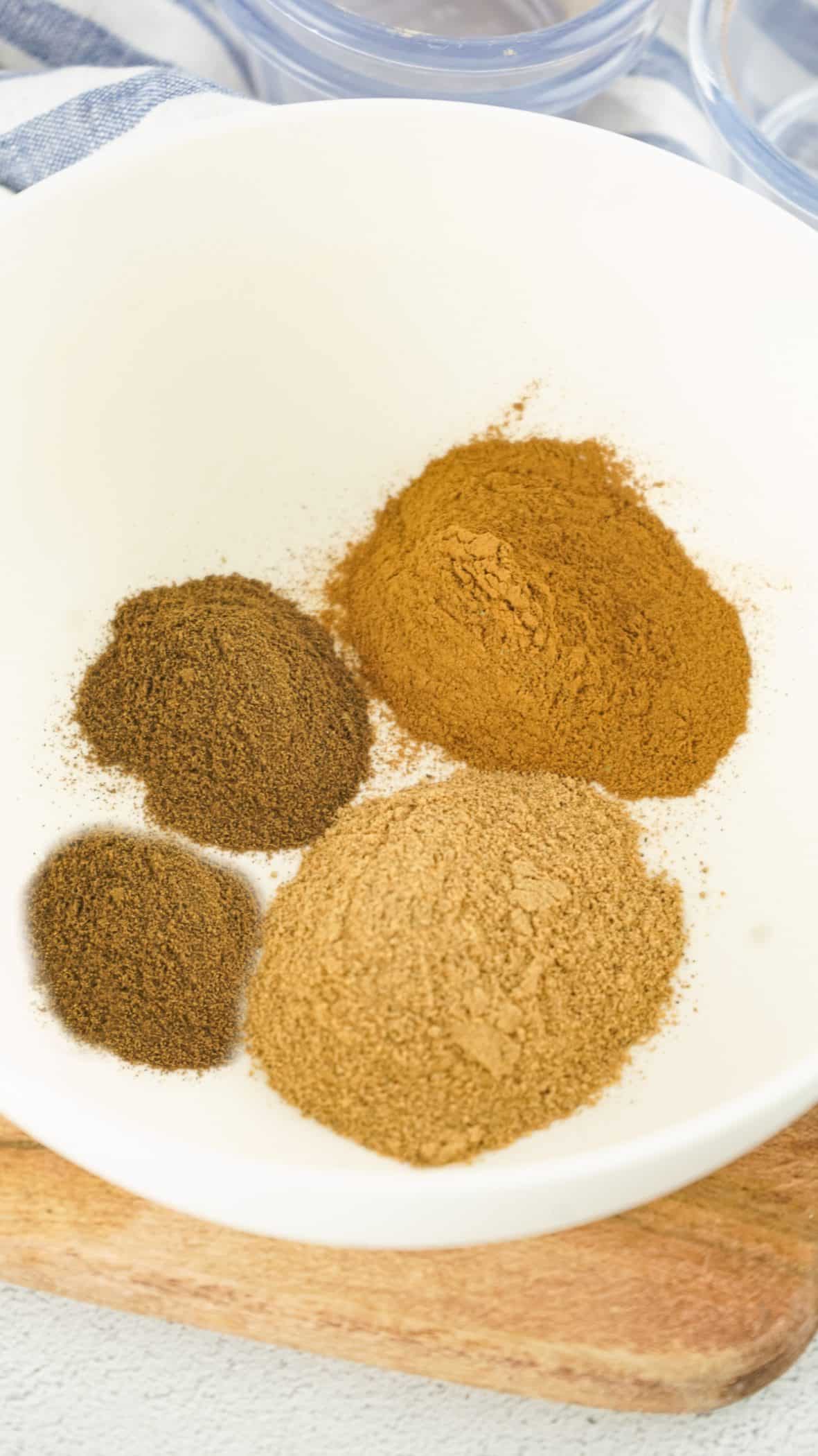 cinnamon, ginger, nutmeg and allspice in a bowl
