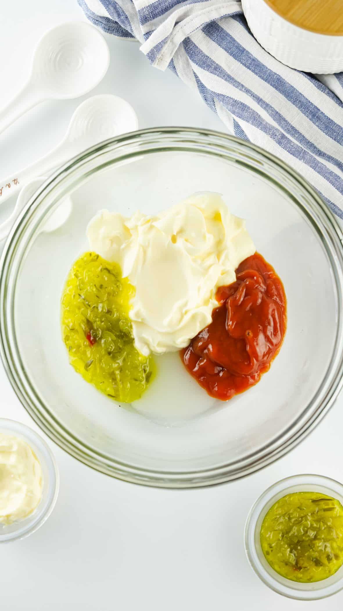 putting ingredients for in n out sauce in a bowl 