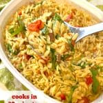 spoonful of baked orzo over casserole dish with text overlay