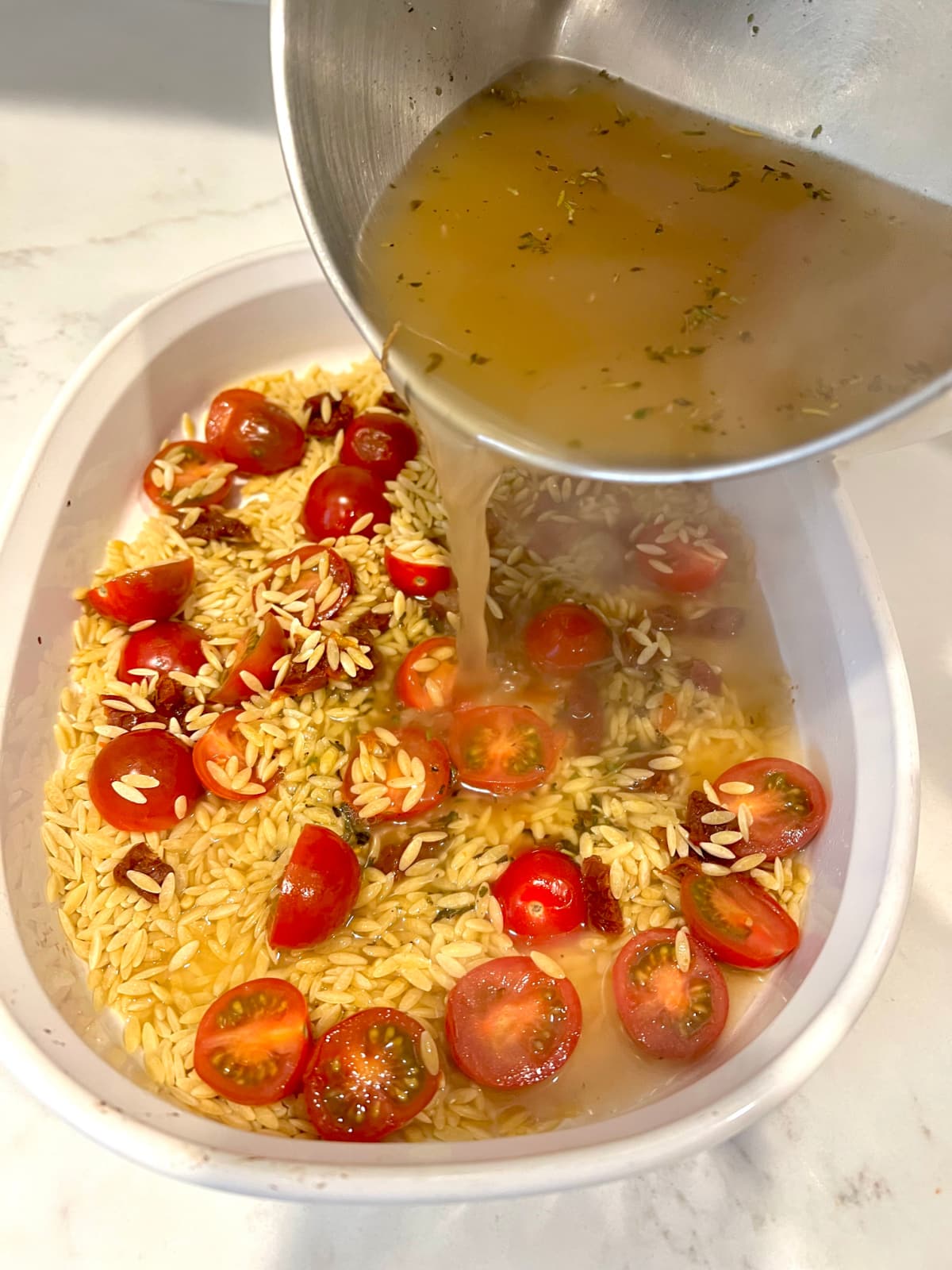 combining broth and orzo for step 3