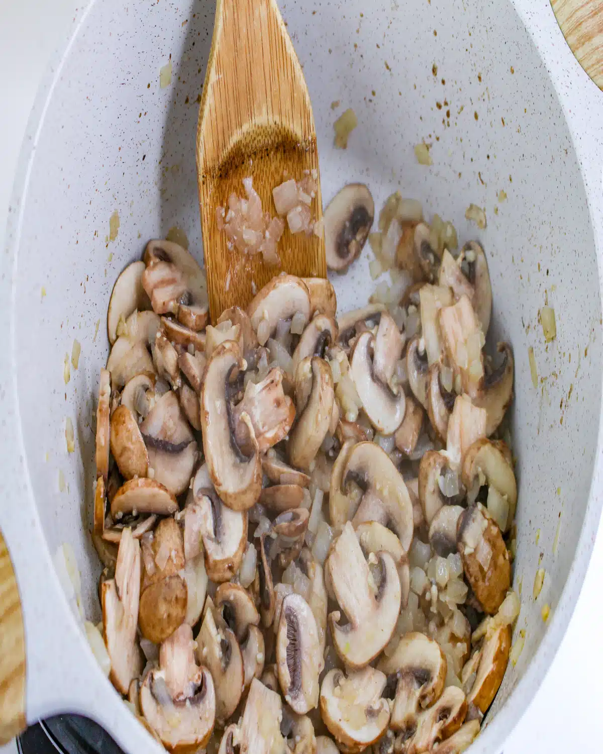 cooking mushrooms, onion and garlic in a dutch oven