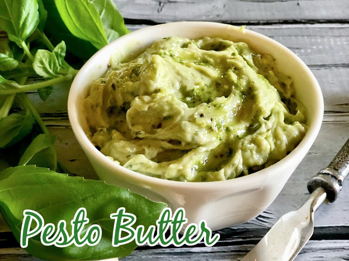 pesto butter in a bowl with fresh basil