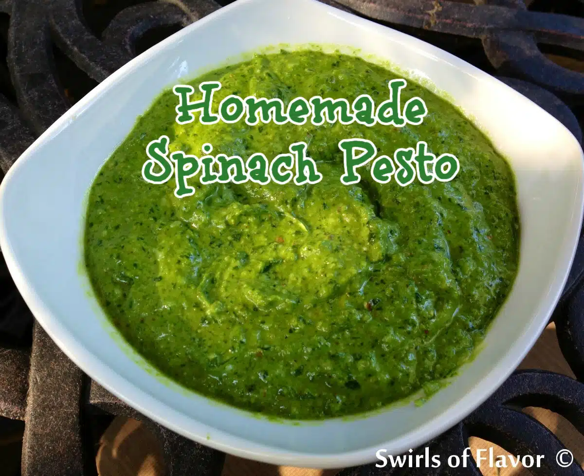 a white bowl of homemade spinach pesto