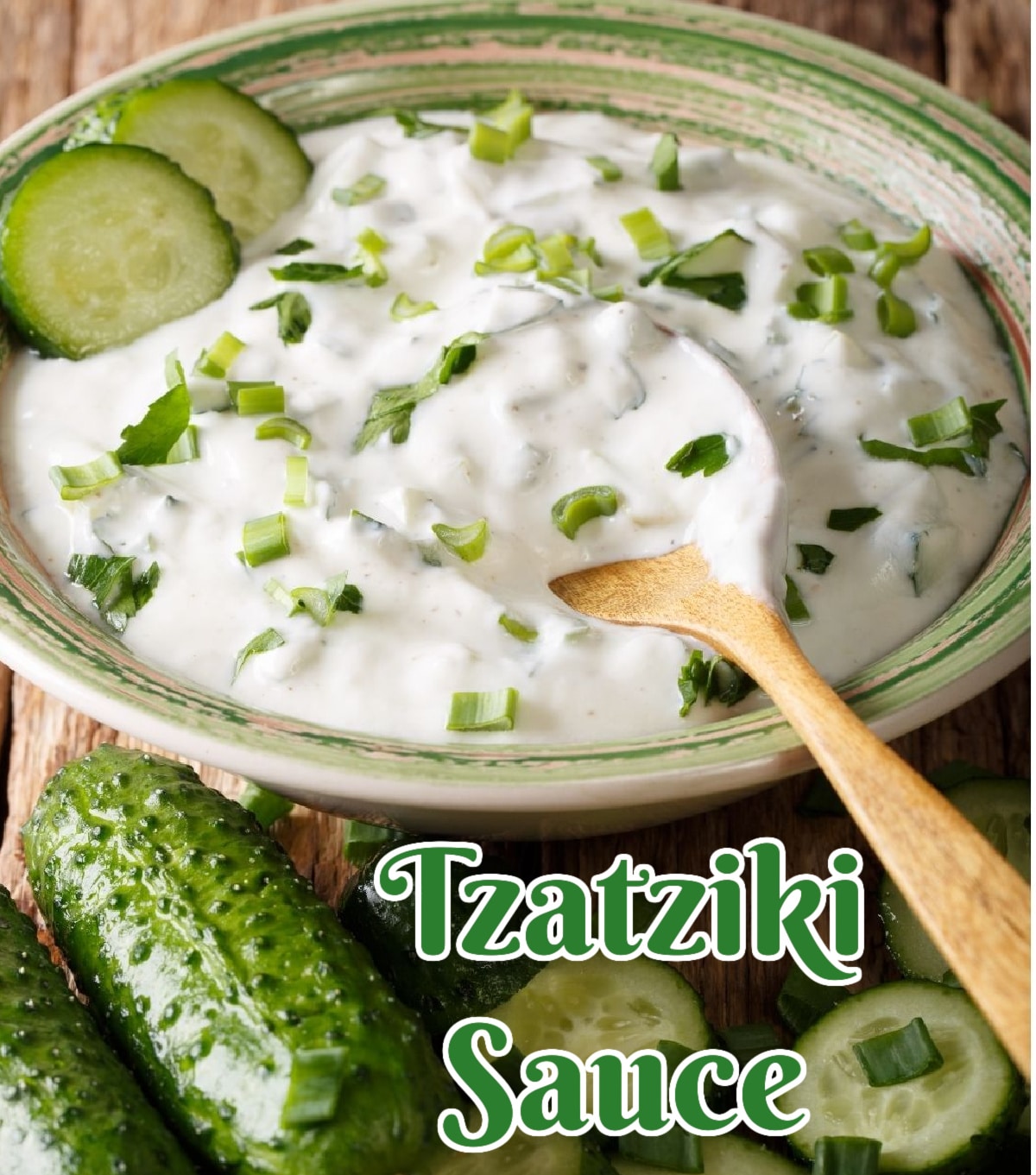 Tzatziki Sauce with cucumber slices and a spoon in a round bowl