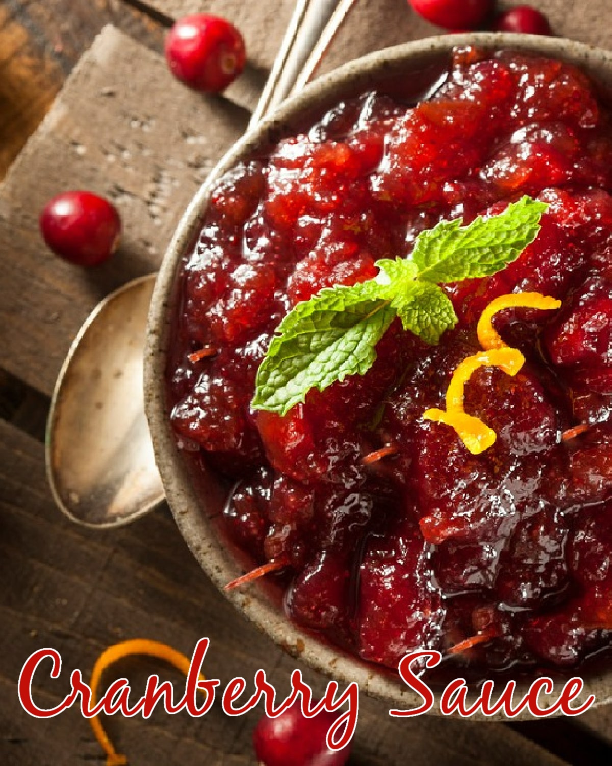 bowl of homemade cranberry sauce with orange peel garnish