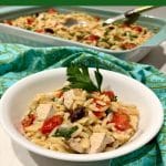 bowl of chicken and pasta with fresh vegetables and text overlay