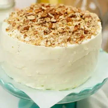 carrot cake with walnuts on a cake stand