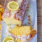 overhead of lemon loaf cake with slices and text overlay