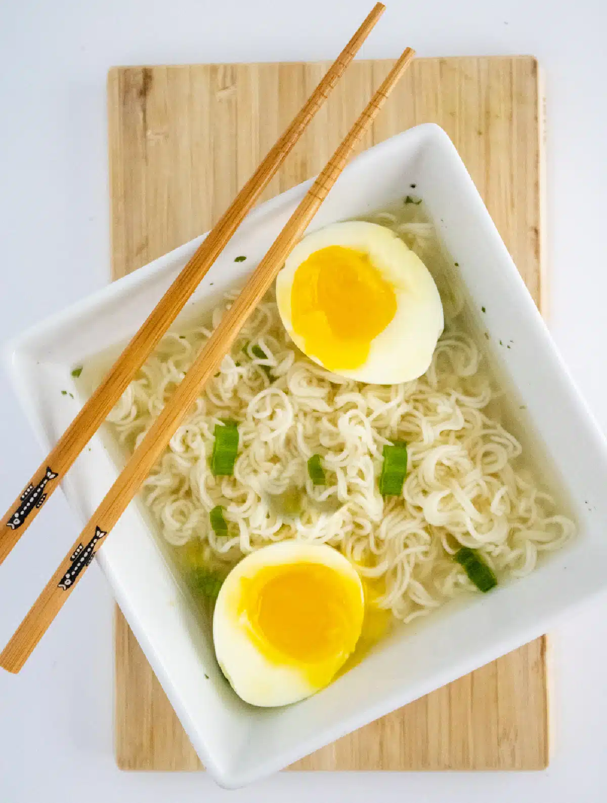 ramen noodles with scallions, egg and chopsticks