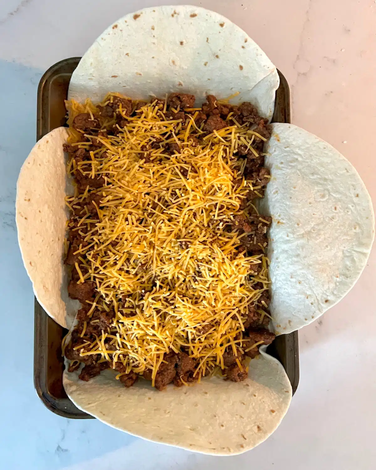 arranging taco filling in pan