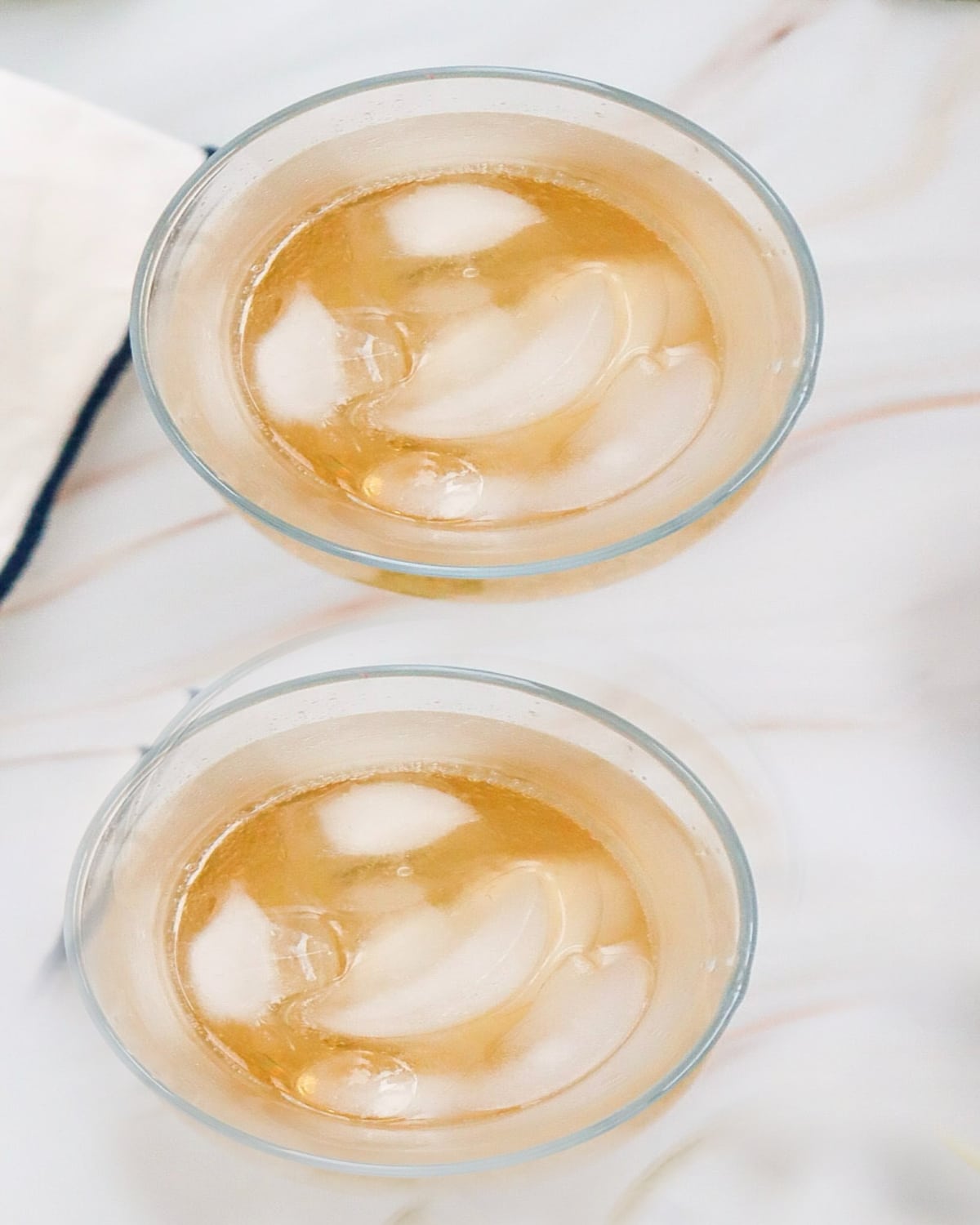 two glasses with ice and soda