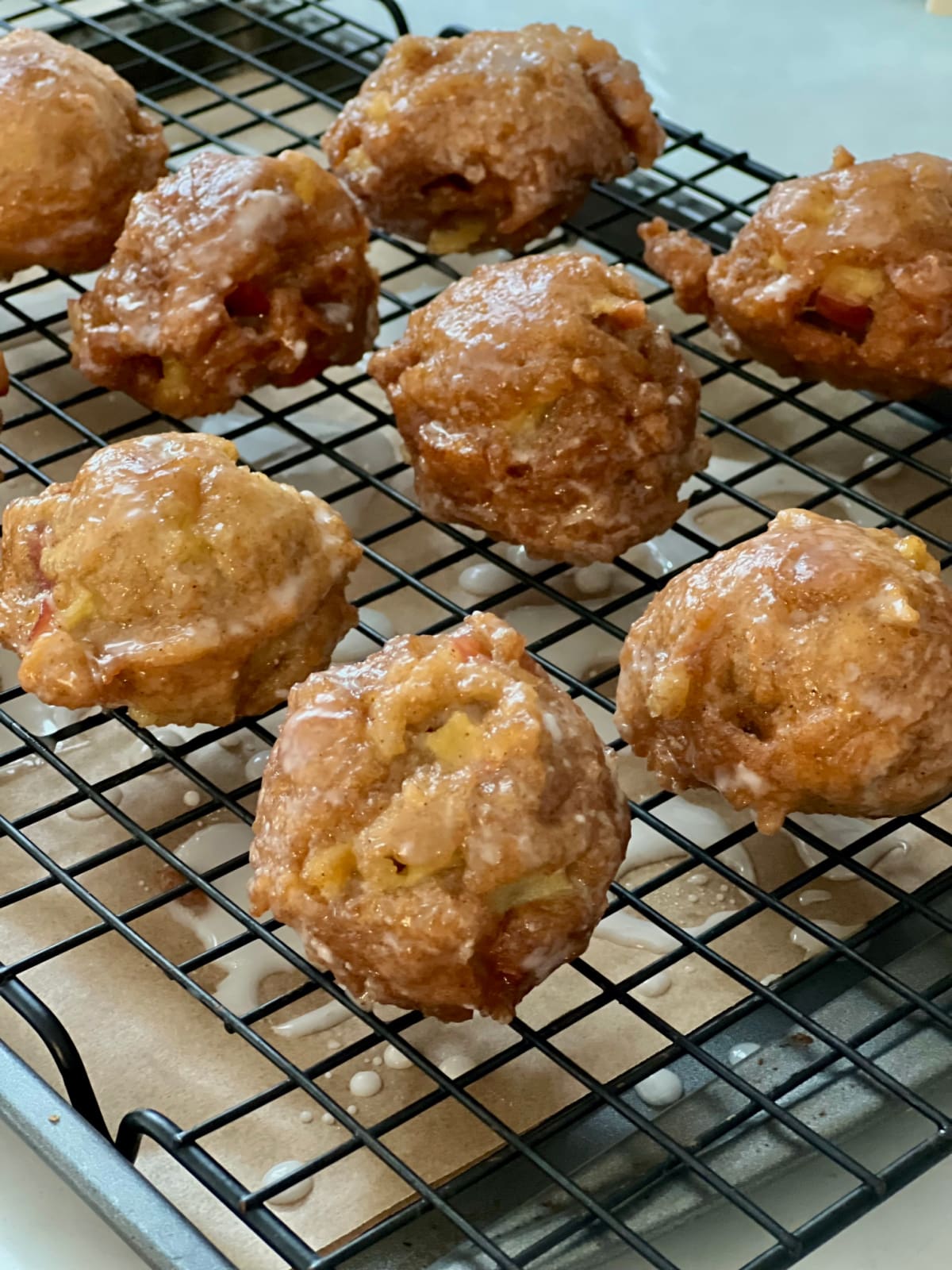 glazed fritters on a wire rack