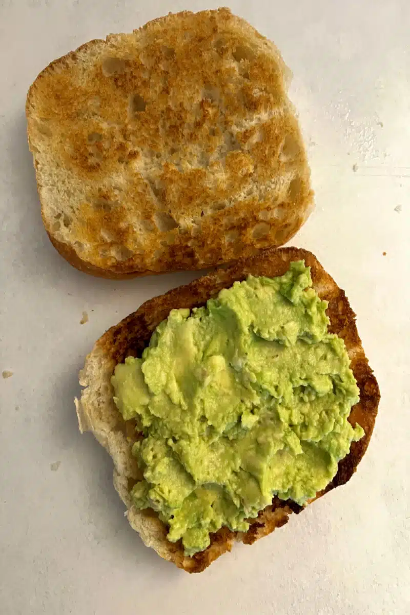toasted rolls topped with mashed avocado