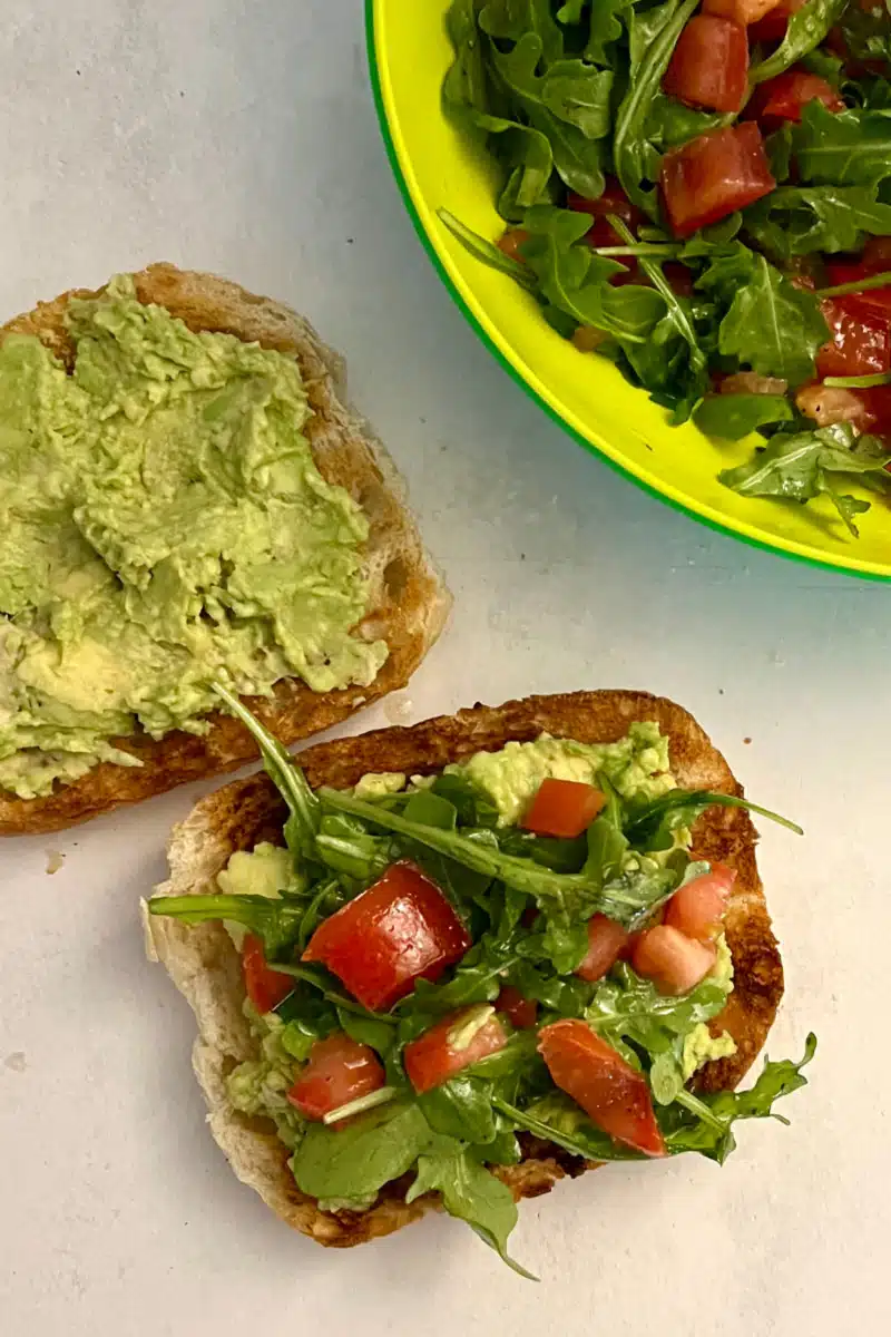 topping toasta with tomato mixture