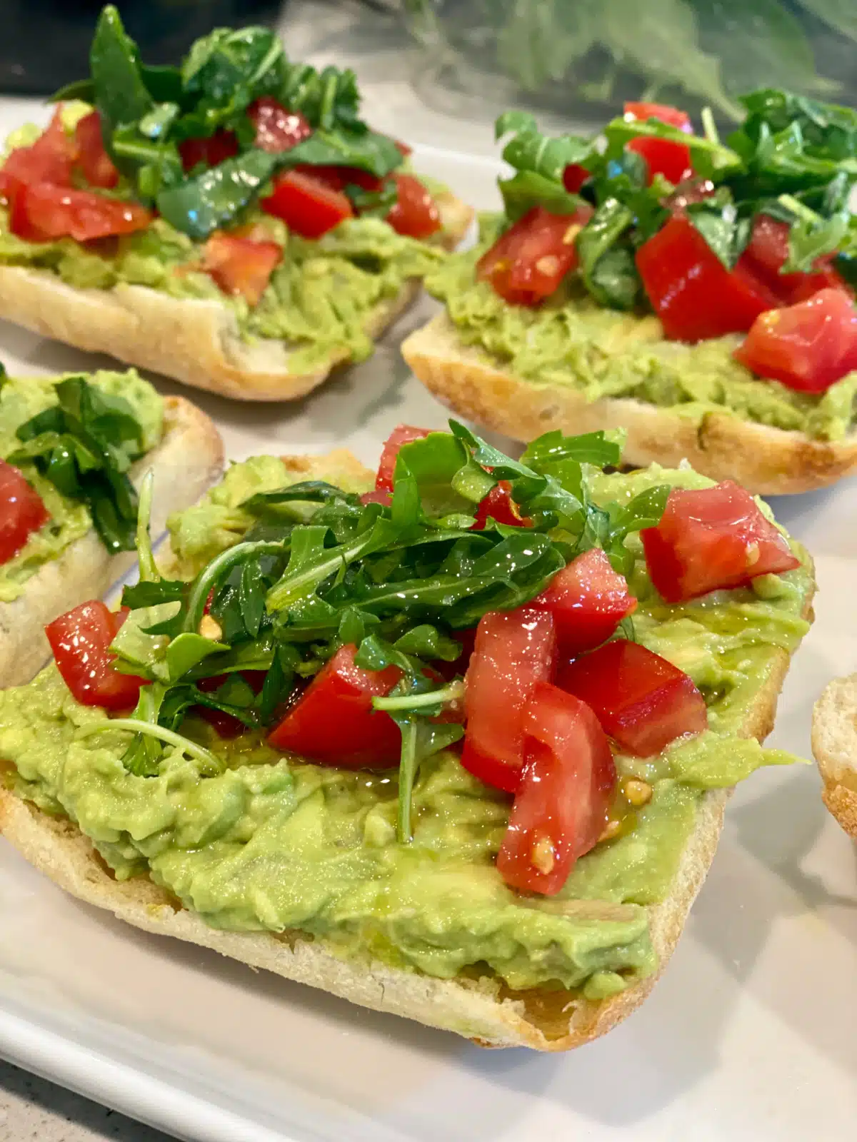 close up of tomato avocado toast