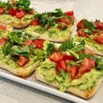 Avocado Toast with tomato on a platter