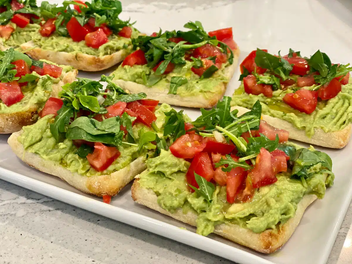 Avocado Toast with tomato on a platter
