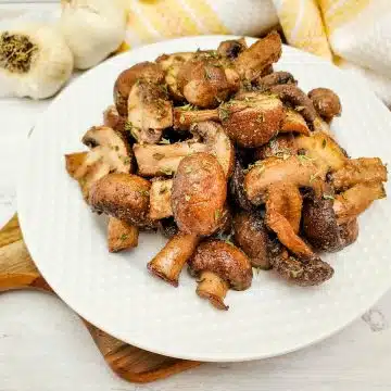 air fried balsamic mushrooms on a white plate
