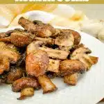 close up of air fried mushrooms on a white plate with text overlay